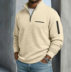 Beige waffle-knit quarter-zip jumper worn with blue jeans, showing the relaxed everyday fit