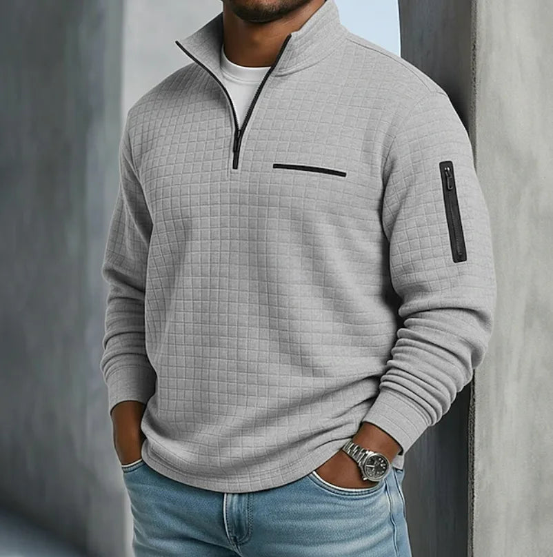 Light grey textured quarter-zip pullover with zip sleeve pocket and stand-up collar