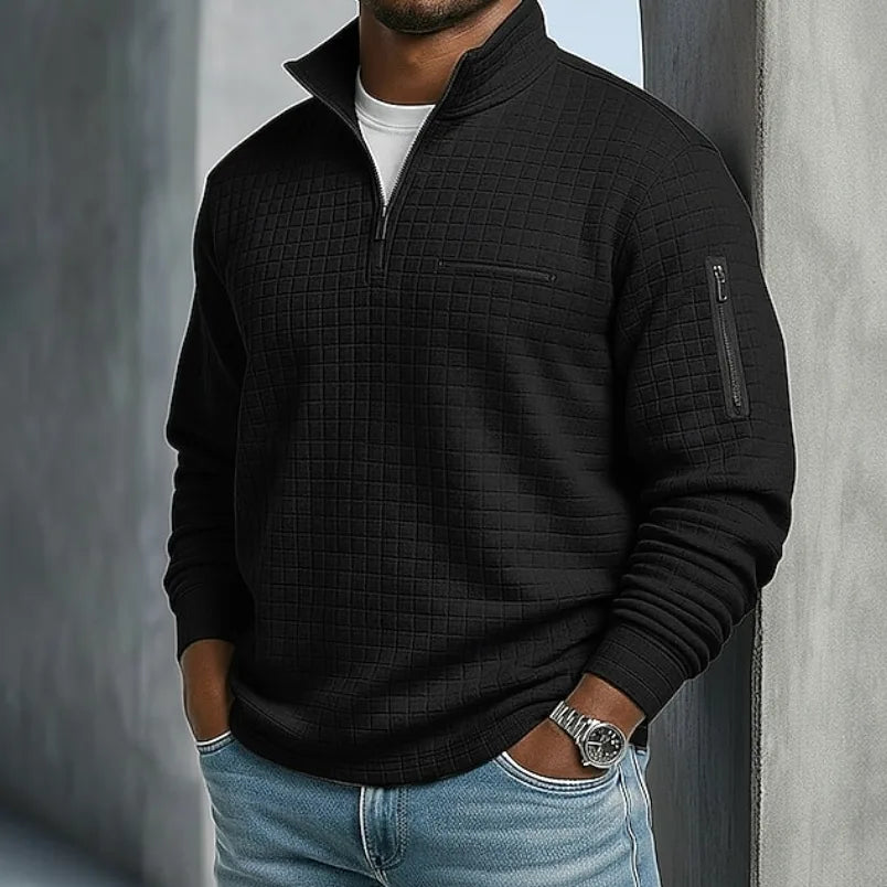 Side angle of a quarter-zip waffle jumper highlighting the textured fabric and sleeve zip pocket detail