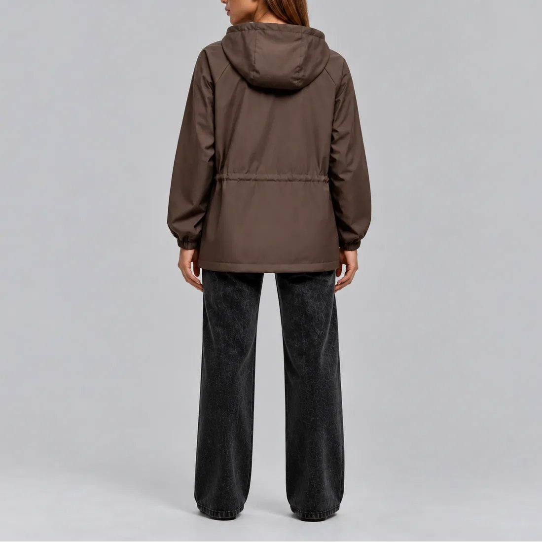 Back view of the brown hooded jacket showing the elasticated drawstring waist and relaxed silhouette