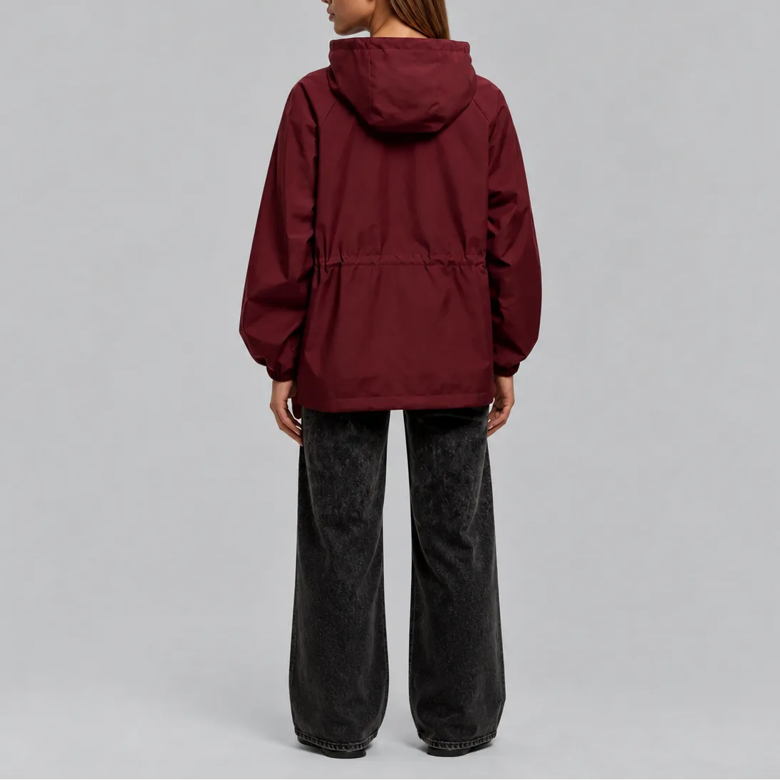 Back view of the burgundy jacket showing the hood, straight hem and relaxed fit