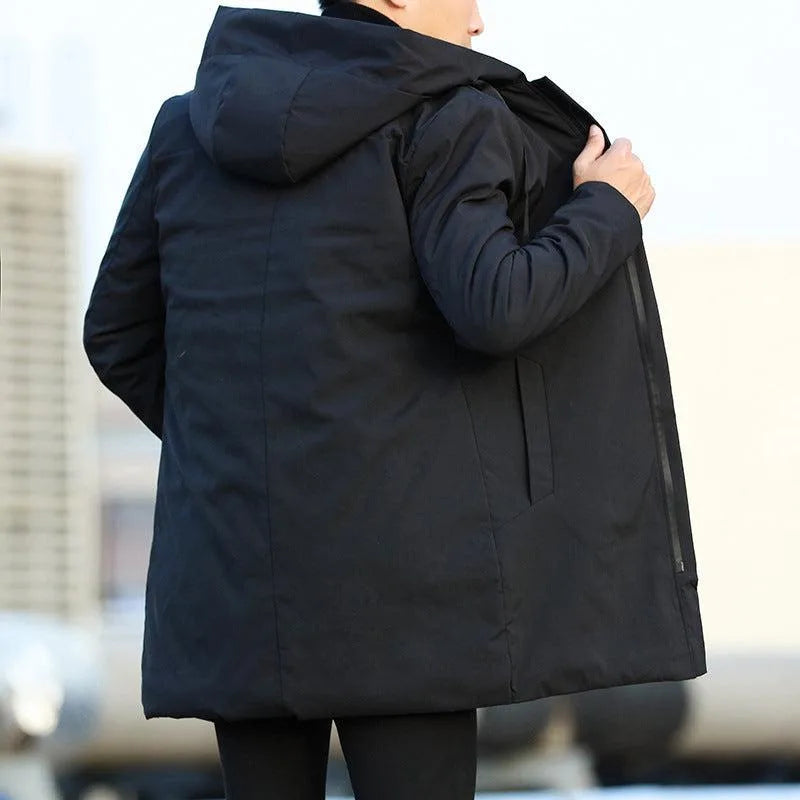 Rear view of a black hooded parka showing the long silhouette, back seam and zip pocket on the reverse side.
