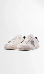 Three-quarter front view of the pair showing the rounded toe and cream-toned sole unit
