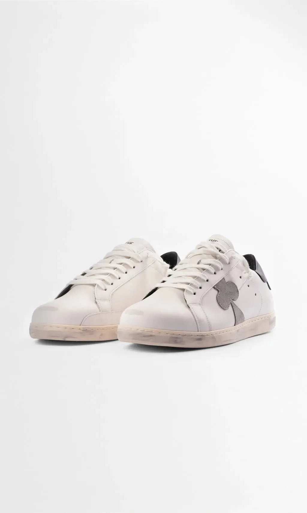 Three-quarter front view of the pair showing the rounded toe and cream-toned sole unit