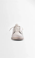 Straight-on front view of the trainer highlighting the lace-up closure and vegan-style laces