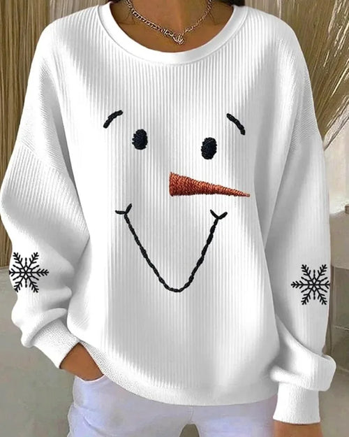 Front view of a white ribbed sweatshirt with an embroidered smiling snowman face and dropped shoulders