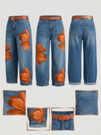 Front, side and back flat lay of the wide leg denim trousers with orange floral print, worn with a tan belt, plus close-up detail shots of the print, hem, belt loop and back pocket
