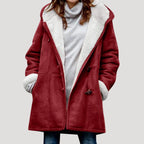 Burgundy red duffle coat with cream borg lining, toggle fastenings and long sleeves, worn open at the front