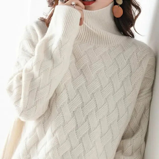 Close-up front view of the ribbed polo neck collar and chunky woven knit texture in cream