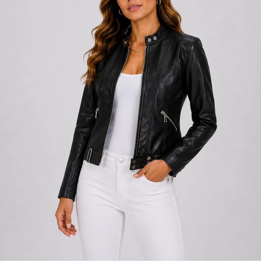 Black faux leather jacket with silver zip pockets and snap-button cuff, worn with white jeans