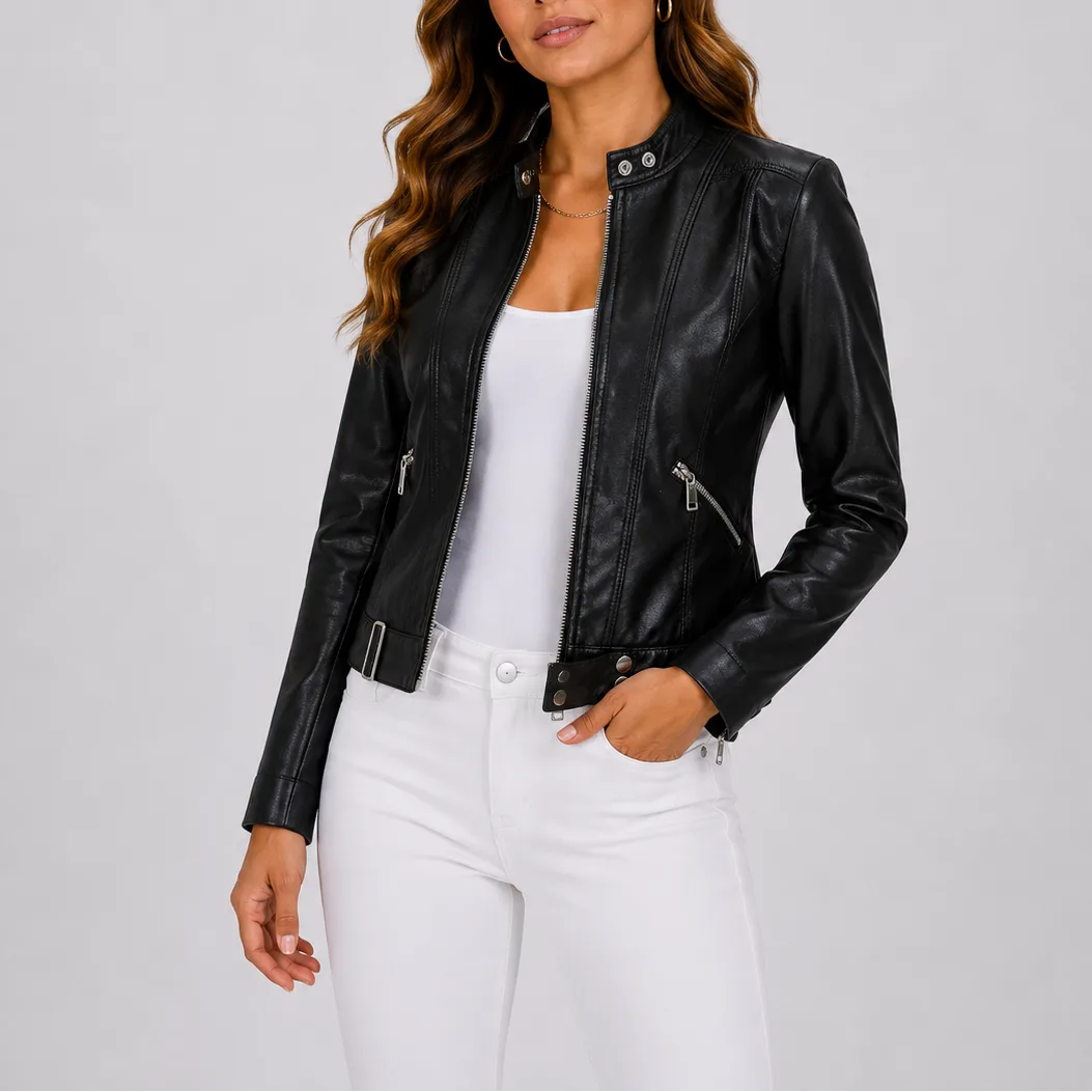Black faux leather jacket with silver zip pockets and snap-button cuff, worn with white jeans