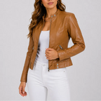 Light brown (tan) faux leather jacket worn open, showing the fitted waist tab and sleeve seam stitching