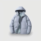Light grey quilted puffer jacket with hood on, zip partly open revealing soft inner lining and ribbed cuffs