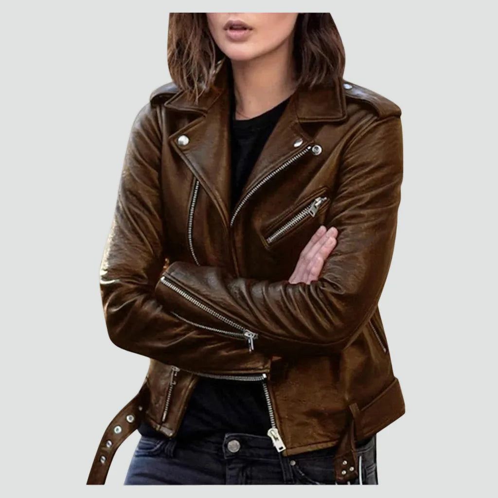 Front view of a brown leather biker jacket with asymmetric zip, silver studs and waist belt