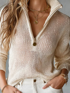 Back view of the beige open-knit half-zip jumper showing the loose knit stitching across the shoulders