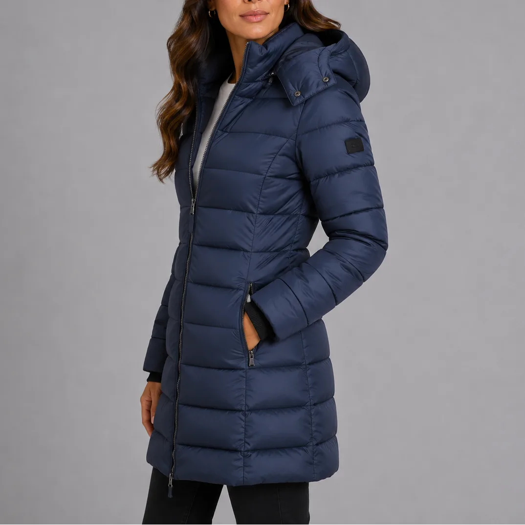 Side profile of the navy hooded puffer coat showing the fitted waist and zip side pocket