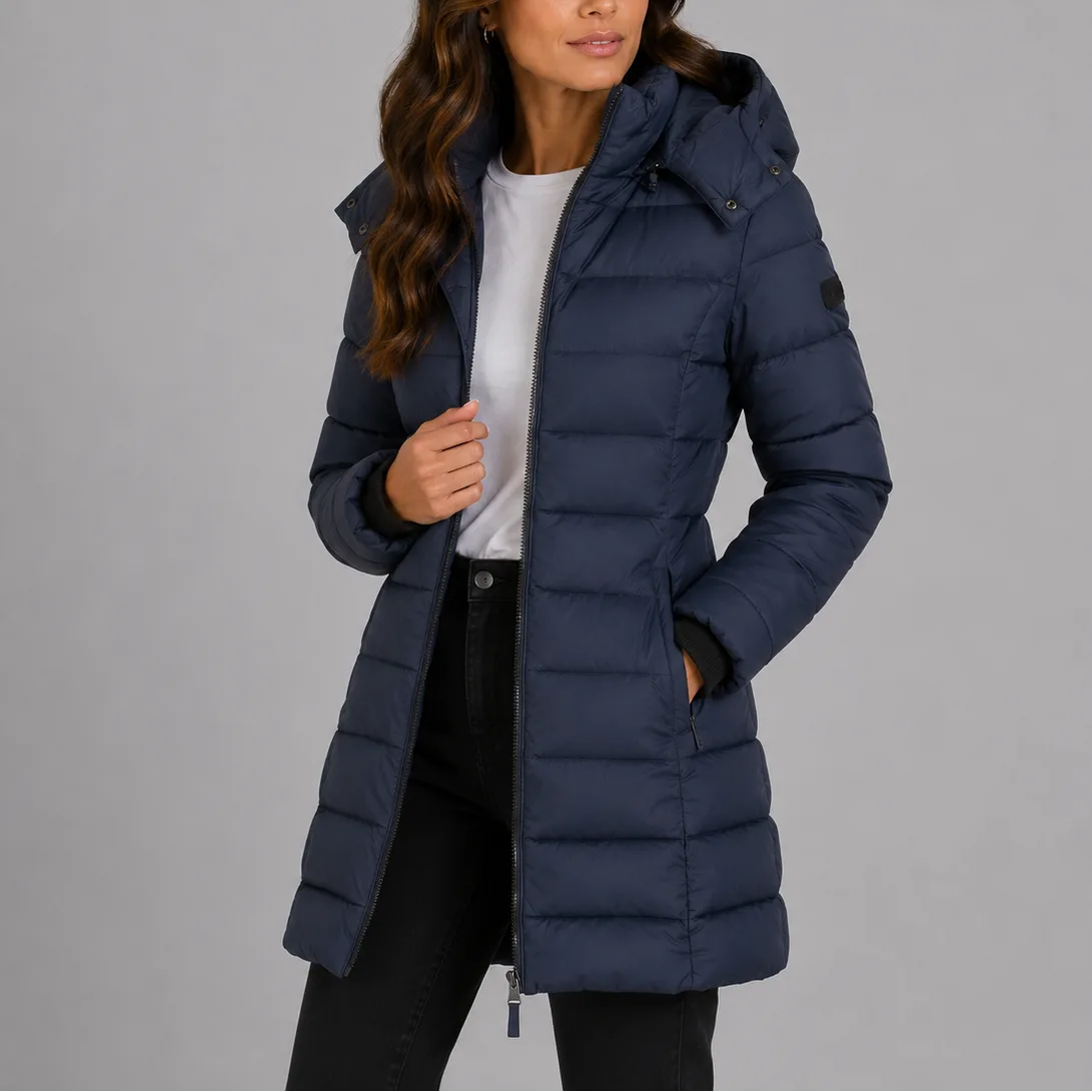 Close-up front view of the navy puffer jacket with hood down, showing the zip fastening and quilted panels