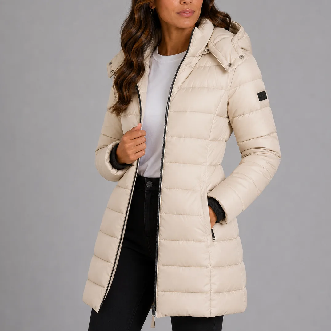 Beige quilted longline puffer jacket with hood, shown open at the front with zip pocket visible