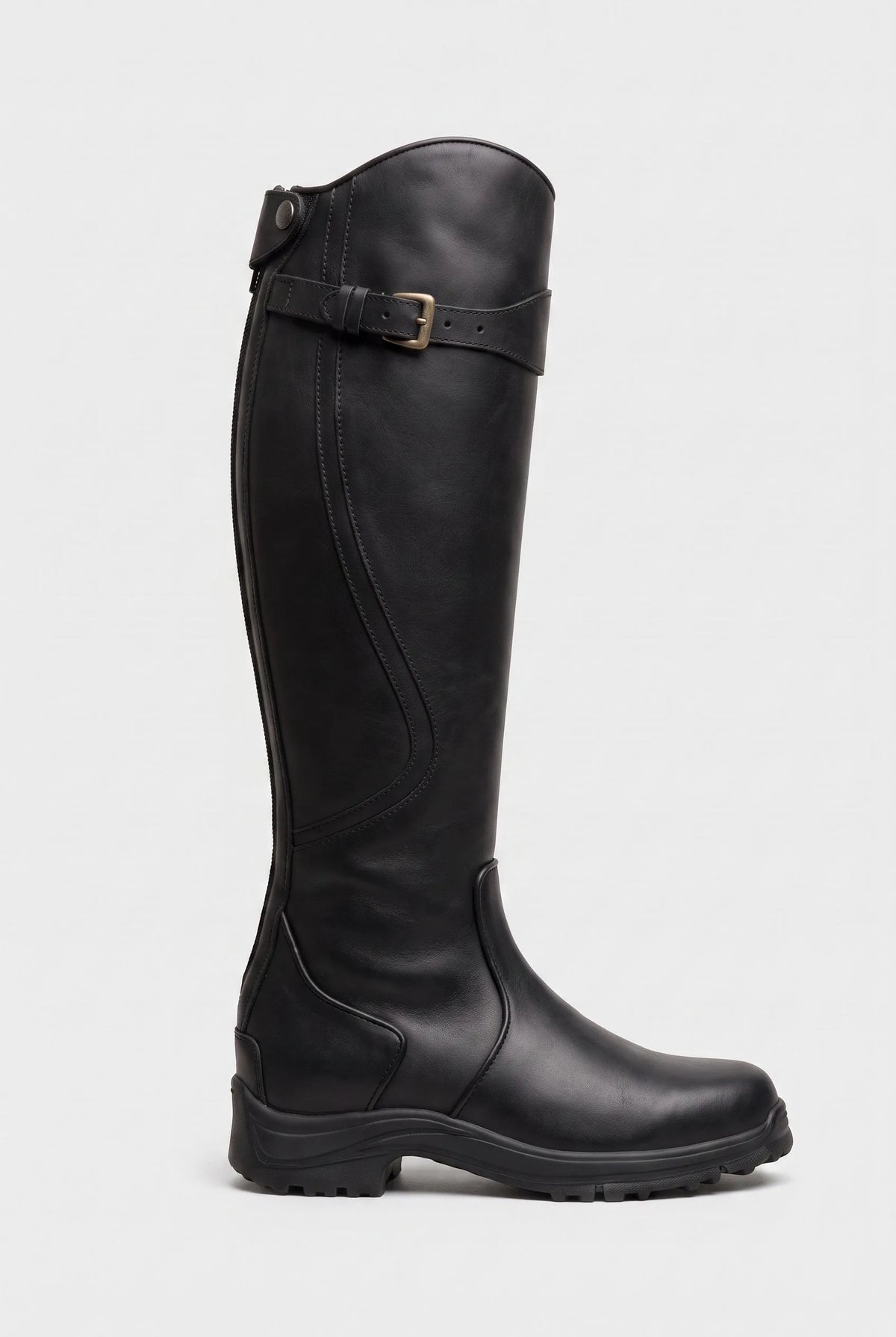 Side view of a matte black knee-high leather boot with buckle strap and sturdy ridged sole