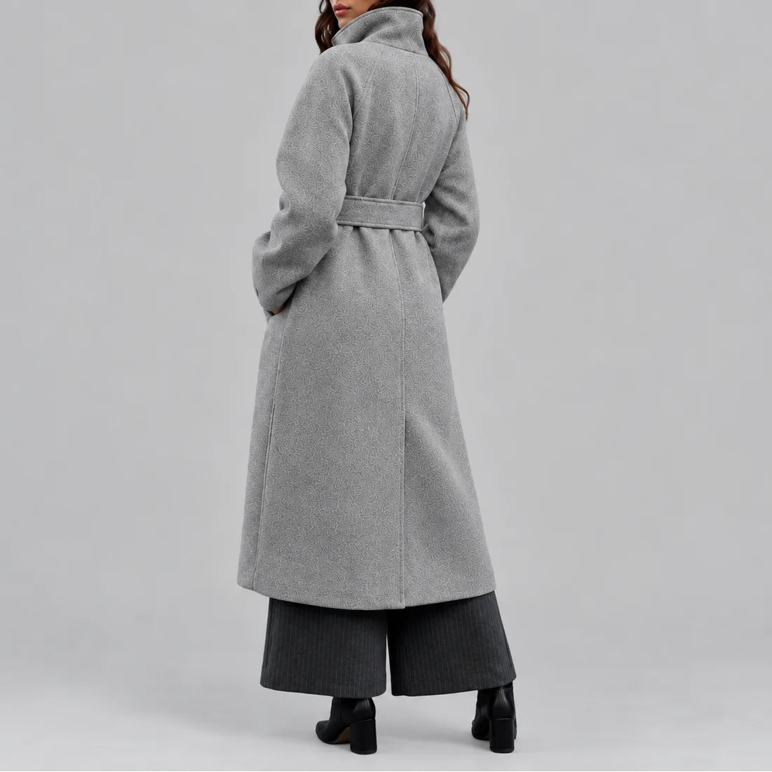 Back view of the grey wrap coat showing raglan sleeves and the tied waist belt