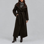 Front view of a dark brown belted wrap coat with wide collar worn over a knit polo neck