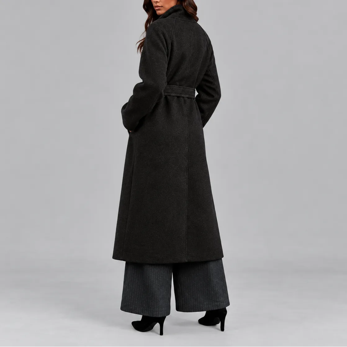 Back view of a charcoal belted wool coat showing its clean silhouette and structured collar